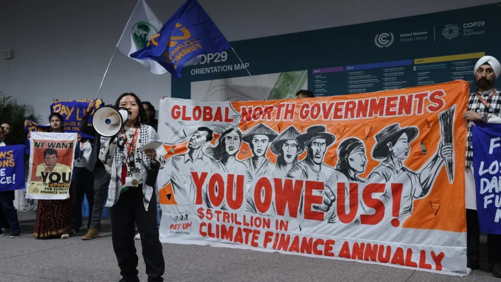 Protesters Demand Fair Climate Finance as COP29 Negotiations Intensify